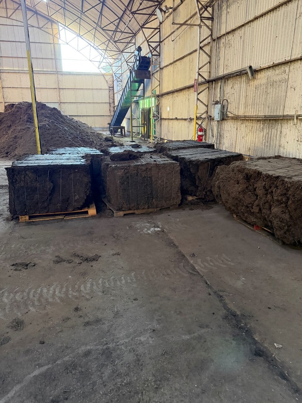 Stabilized SGP+ bales staged in the Napoleonville warehouse
